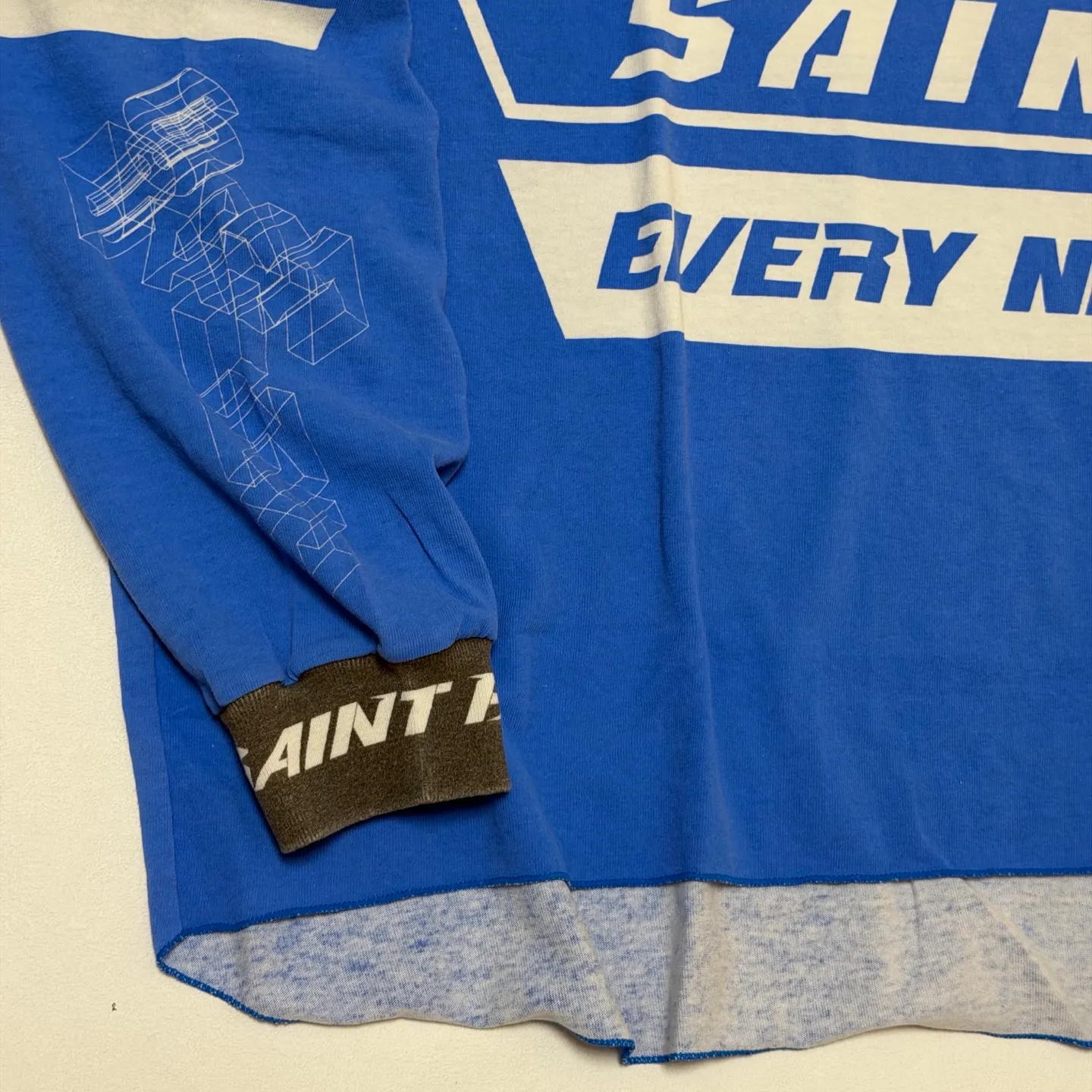 SAINT Mxxxxx Make the printing look distressed and white. Correct accessories. Customized co-branded model with P.A.M. wash mark.